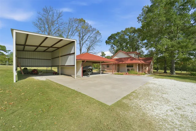 a front view of a house with a garden and yard
