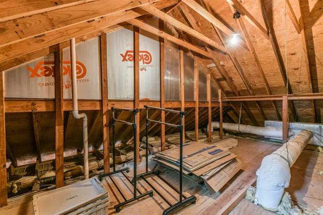 a backyard of a house with barbeque oven table and chairs