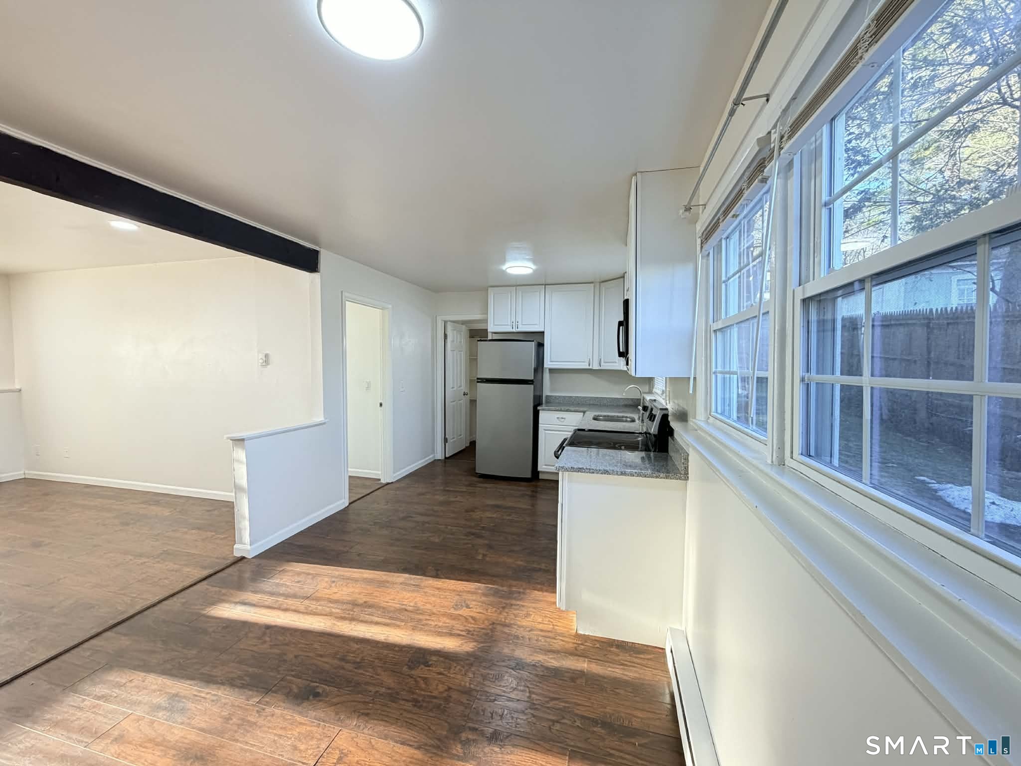 12 Terrace Place, Unit 2 New Milford, CT 06776 - Photo 5 of 11 a kitchen with a refrigerator and a counter top space