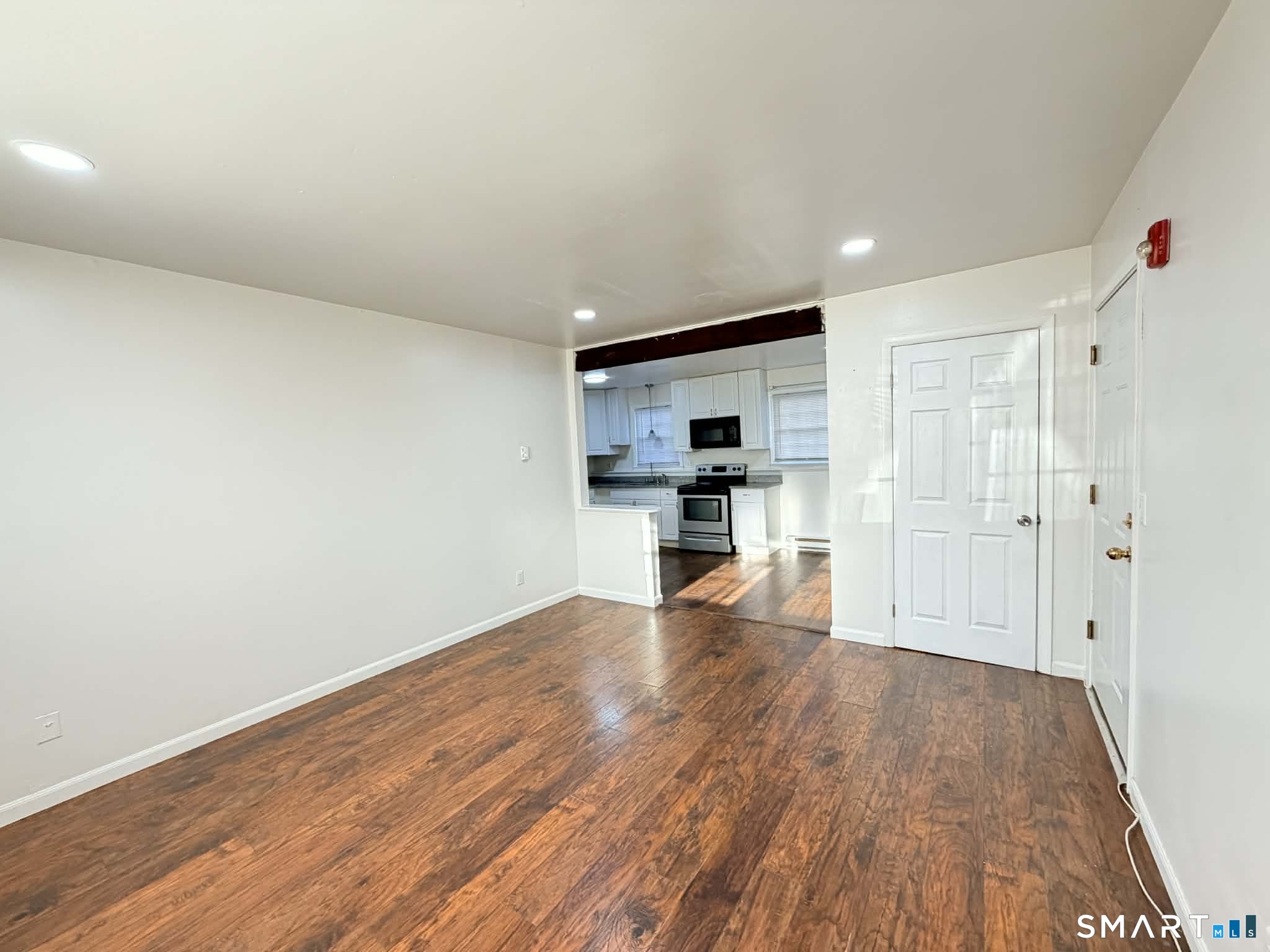 12 Terrace Place, Unit 2 New Milford, CT 06776 - Photo 6 of 11 a view of kitchen with wooden floor and electronic appliances
