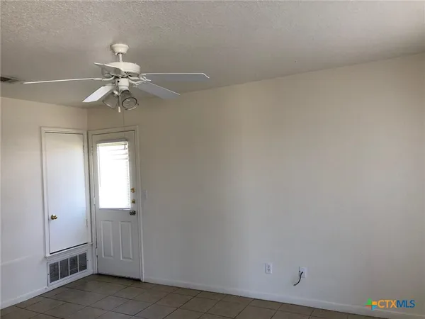 a view of a chandelier fan in a room