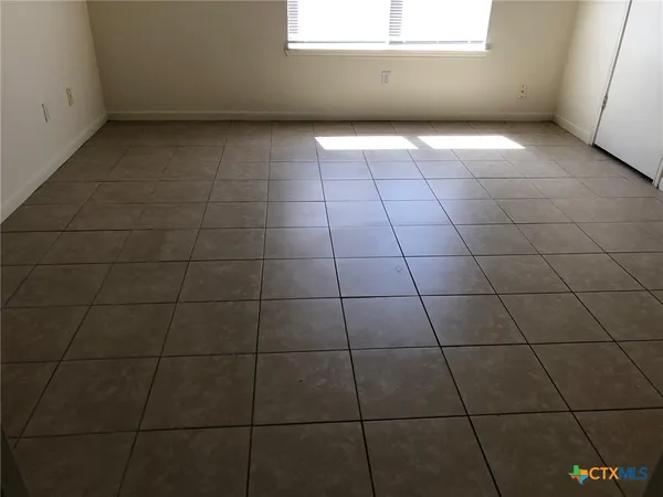 a view of a room with a window