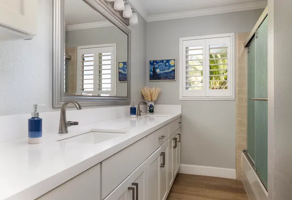 a bathroom with a sink and a window