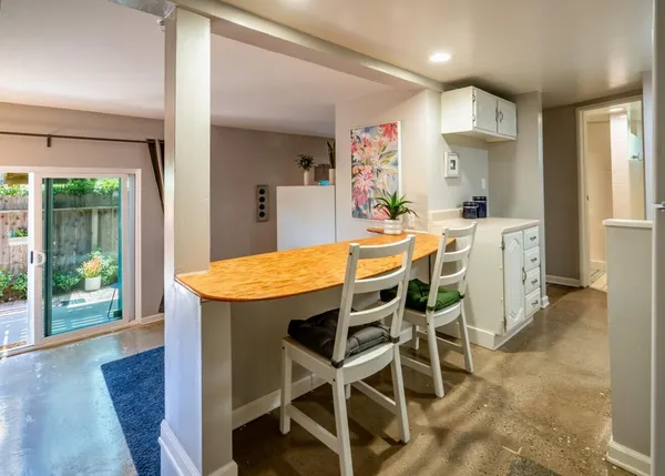 a dining room with furniture and window