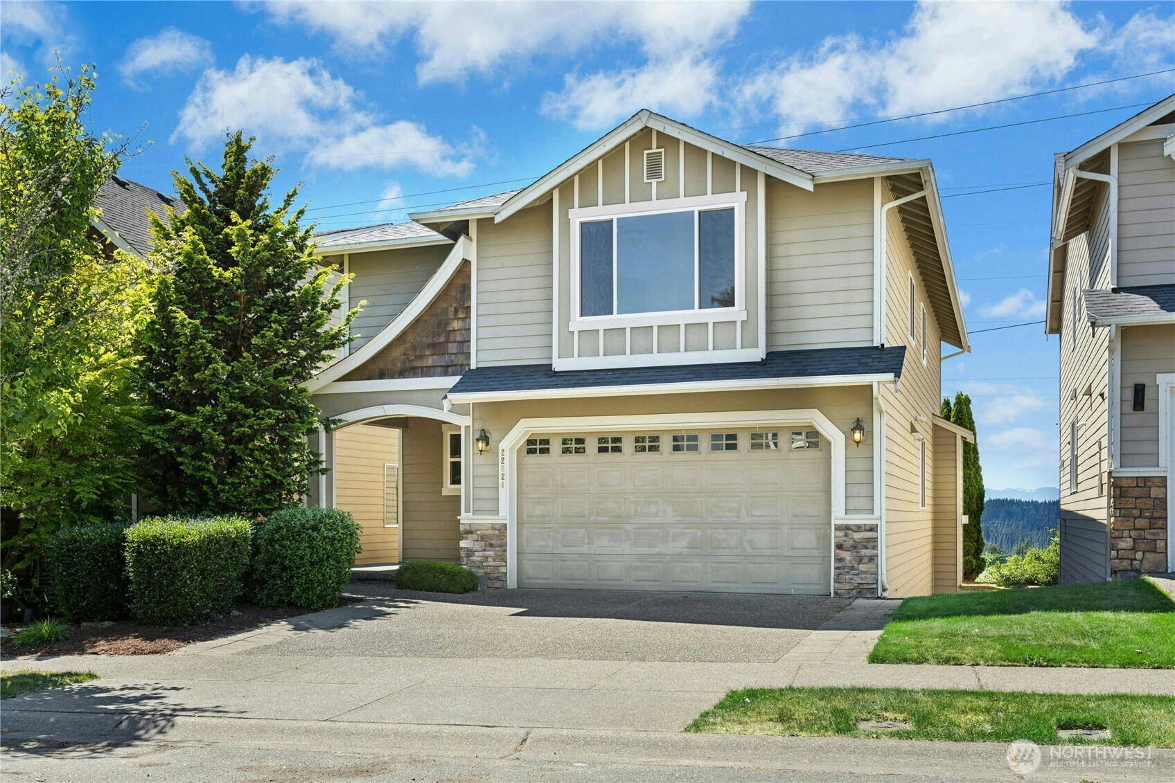 22624 43rd Drive Southeast Bothell, WA 98021 - Photo 2 of 36 a front view of a house with a garden