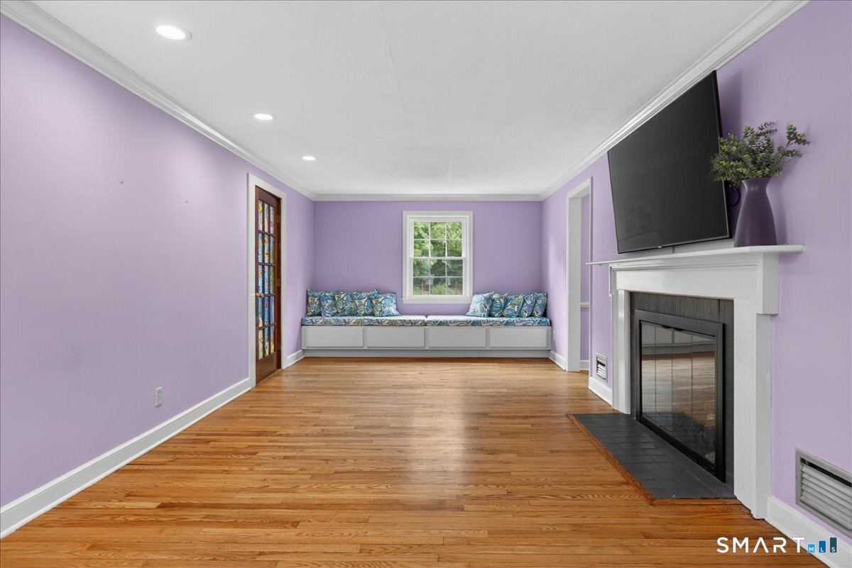 1006 King Road Cheshire, CT 06410 - Photo 10 of 40 The Living Room is large for ample seating and has custom bench seating with storage.