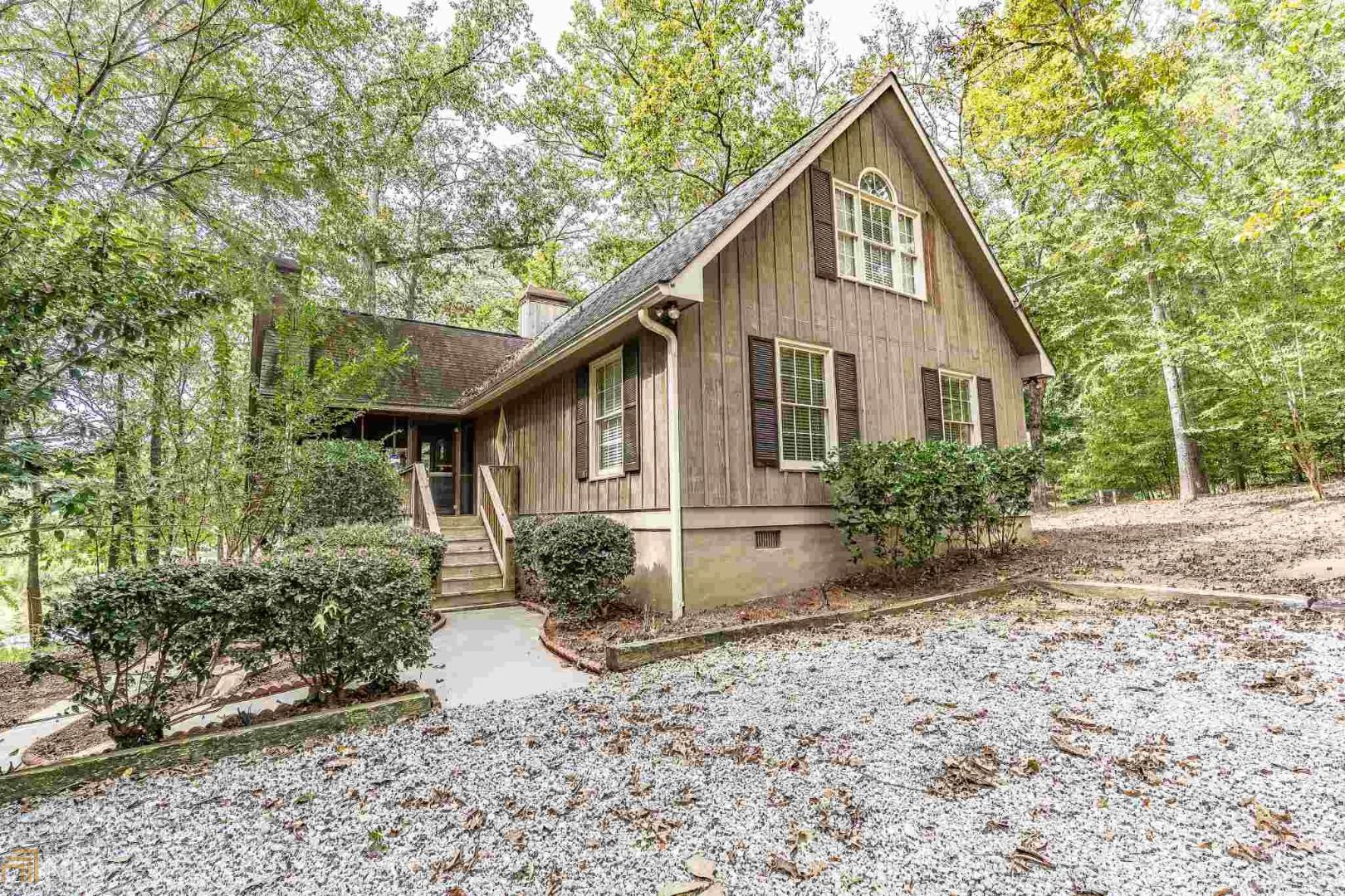 1470 Point Royal Road Greensboro, GA 30642 - Photo 1 of 1 a view of a house with a yard and plants