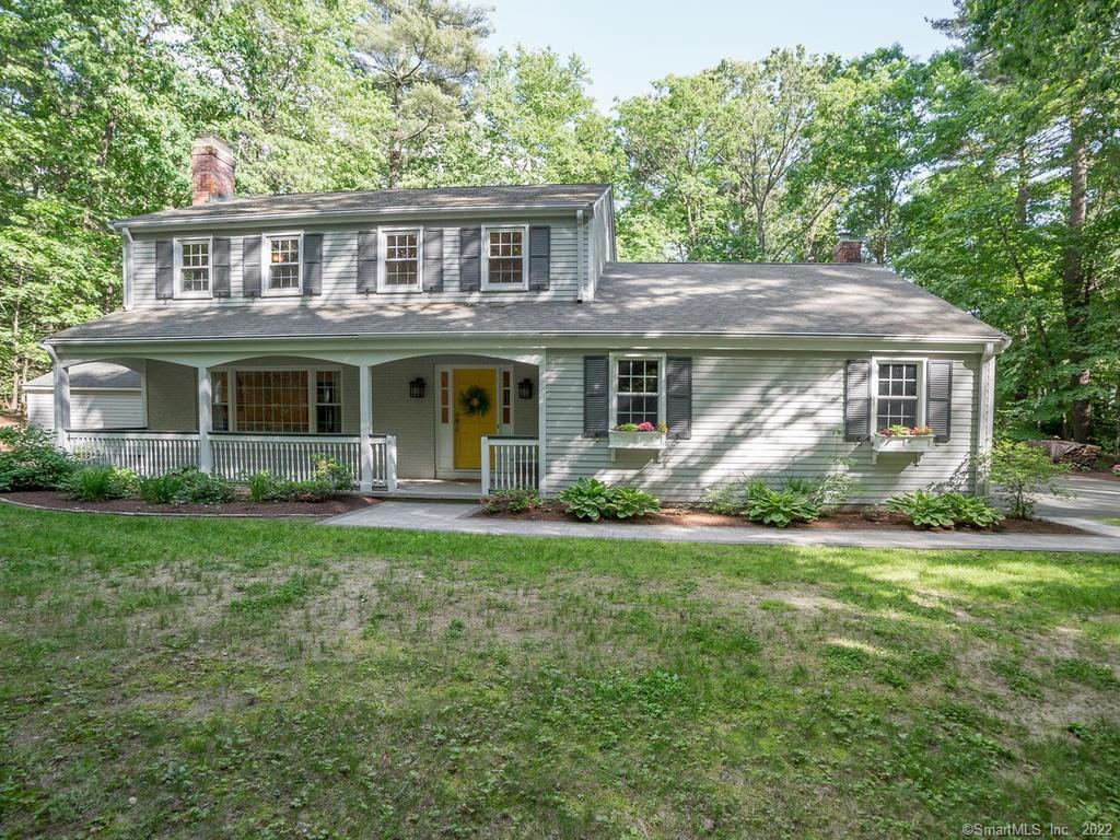 69 Canton Road Simsbury, CT 06092 - Photo 1 of 1 a front view of a house with a garden