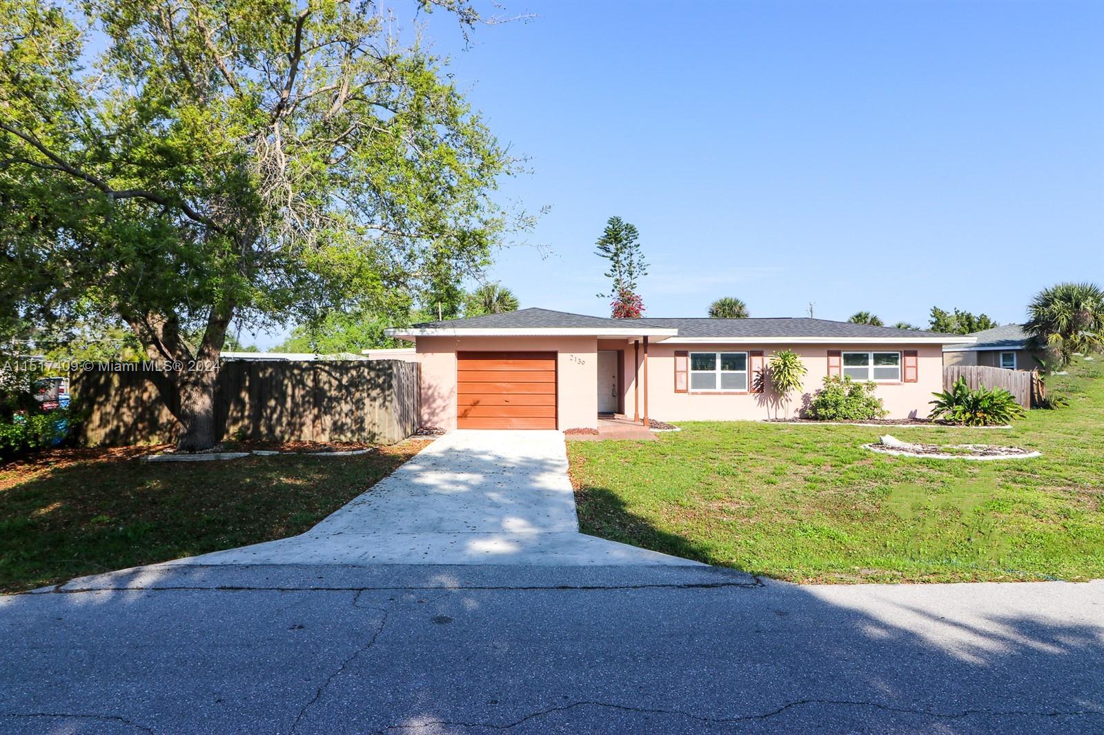 2139 Delta Street Port Charlotte, FL 33952 - Photo 1 of 43 front view of a house with a yard