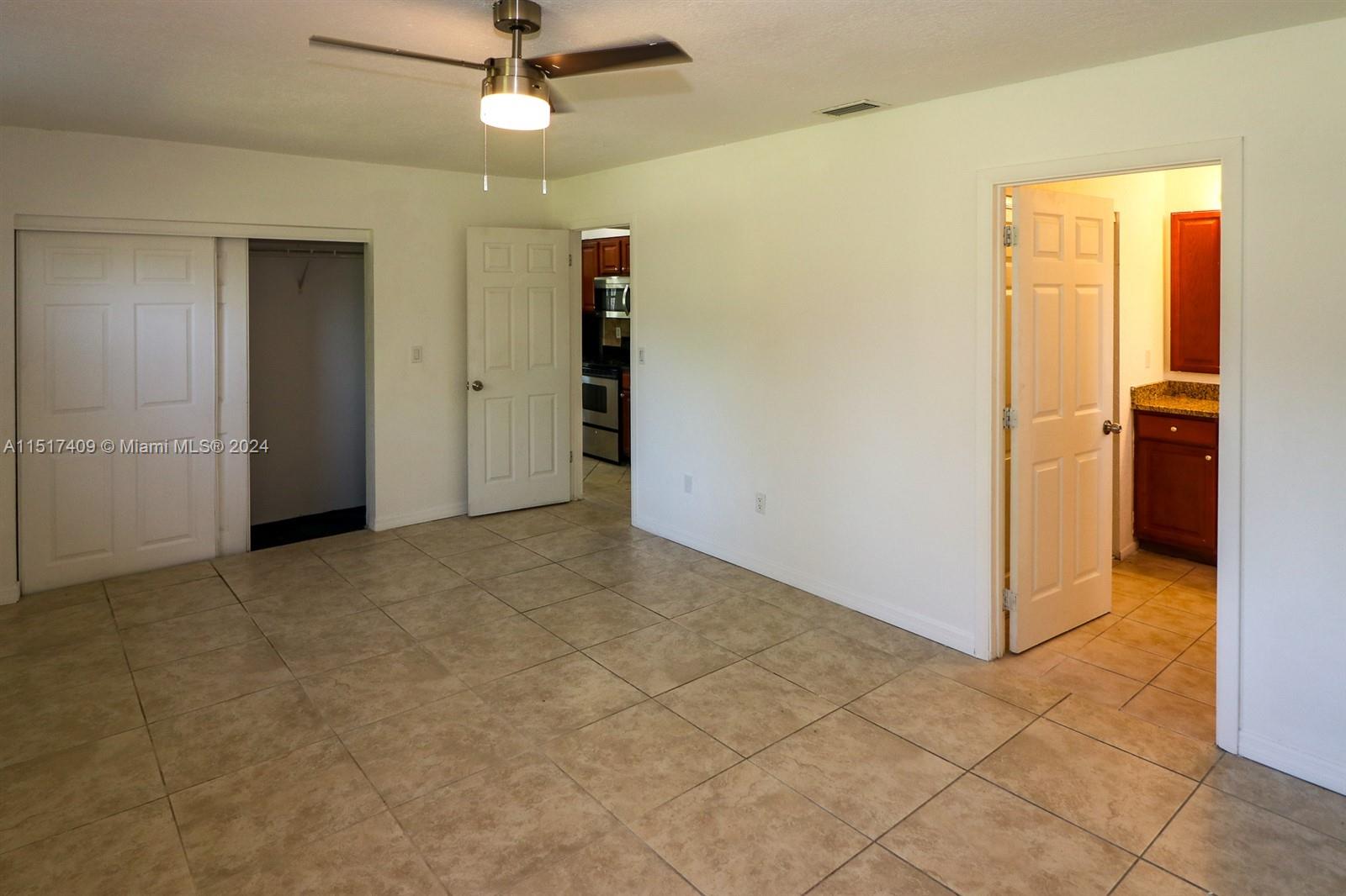 2139 Delta Street Port Charlotte, FL 33952 - Photo 22 of 43 an empty room with closet and a chandelier fan