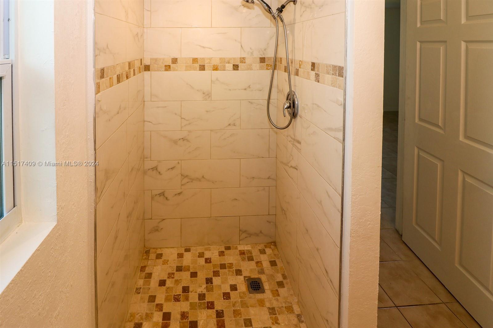 2139 Delta Street Port Charlotte, FL 33952 - Photo 25 of 43 a bathroom with a shower