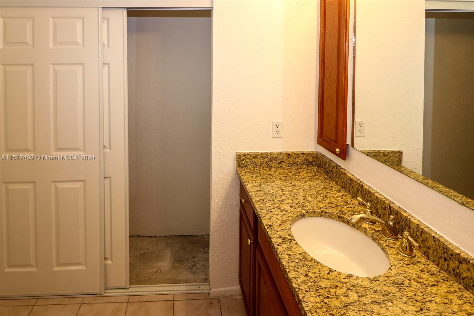 2139 Delta Street Port Charlotte, FL 33952 - Photo 26 of 43 a bathroom with a granite countertop window and a sink