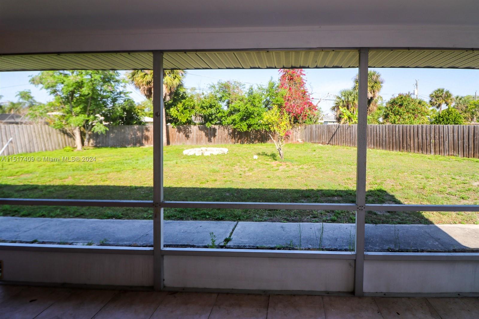 2139 Delta Street Port Charlotte, FL 33952 - Photo 35 of 43 a view of a back yard from a balcony