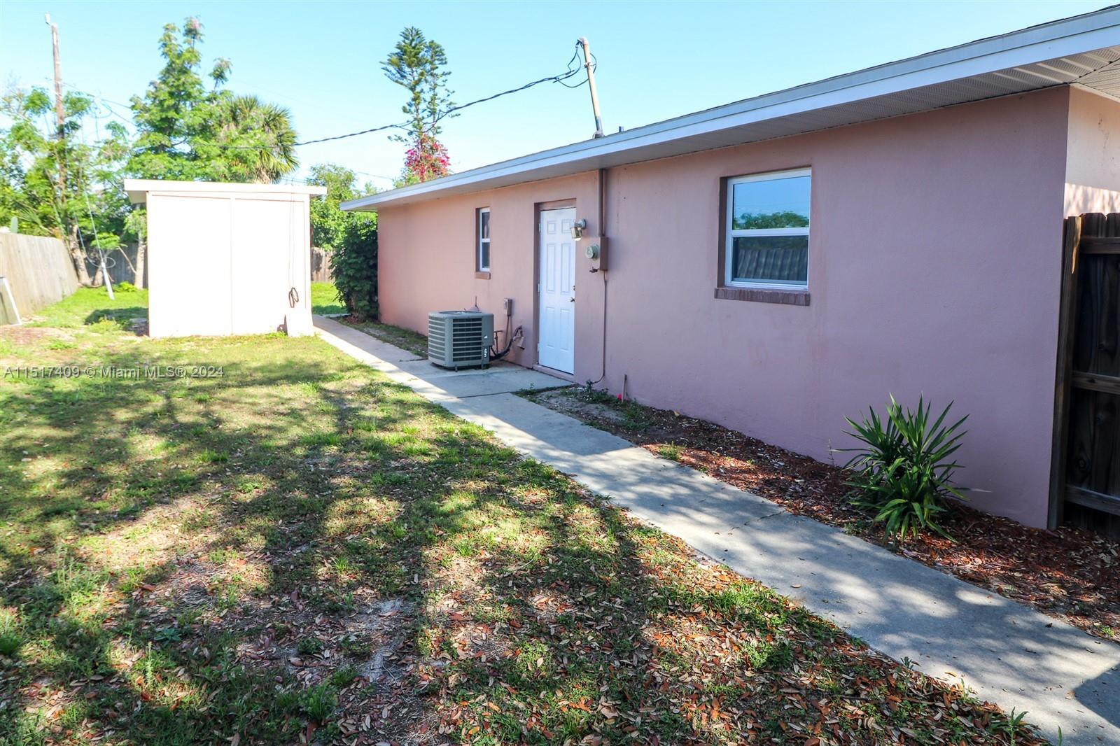 2139 Delta Street Port Charlotte, FL 33952 - Photo 43 of 43 a backyard of a house