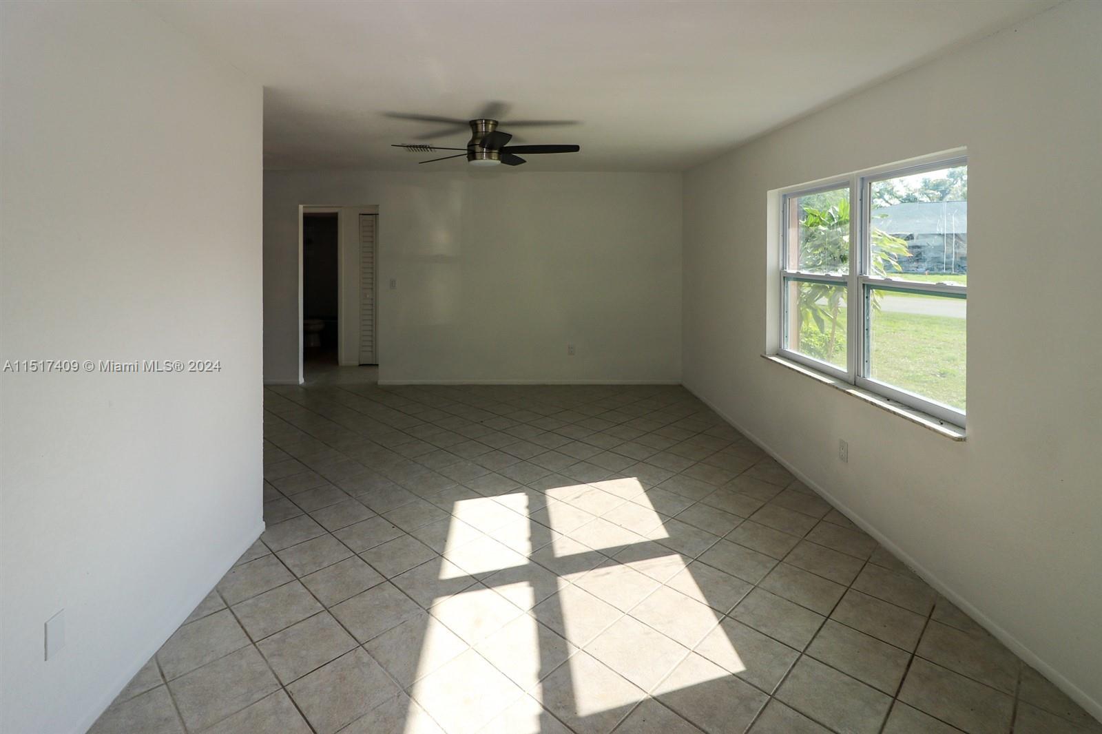 2139 Delta Street Port Charlotte, FL 33952 - Photo 5 of 43 an empty room with a window