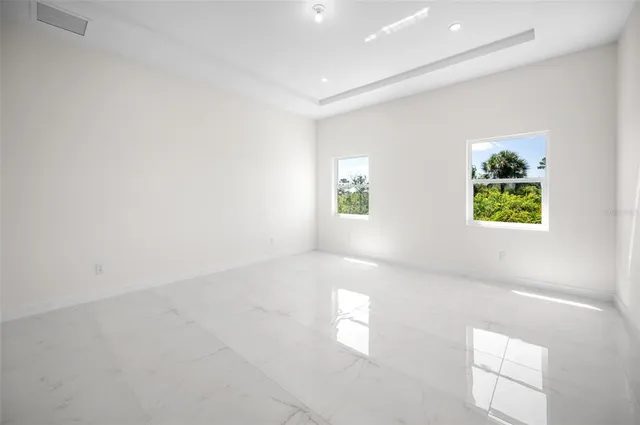 a view of bathroom with a sink a mirror and a shower