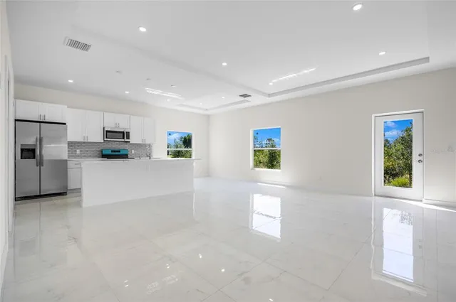 a view of a kitchen with furniture and a window