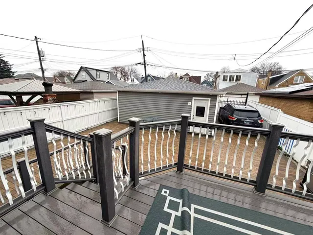 a view of a balcony with car parked