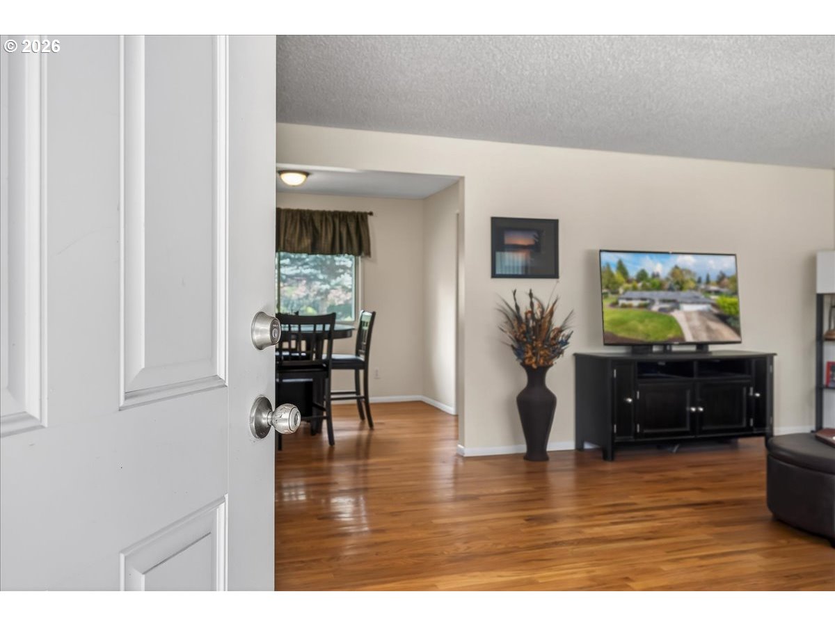 19650 Southwest Jaylee Street Beaverton, OR 97078 - Photo 11 of 46 a living room with furniture and a flat screen tv