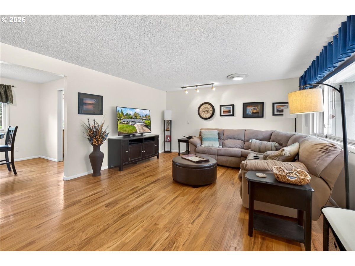 19650 Southwest Jaylee Street Beaverton, OR 97078 - Photo 13 of 46 a living room with furniture and wooden floor