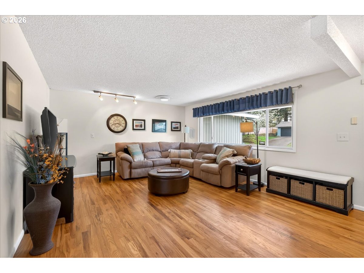 19650 Southwest Jaylee Street Beaverton, OR 97078 - Photo 15 of 46 a living room with furniture window and wooden floor