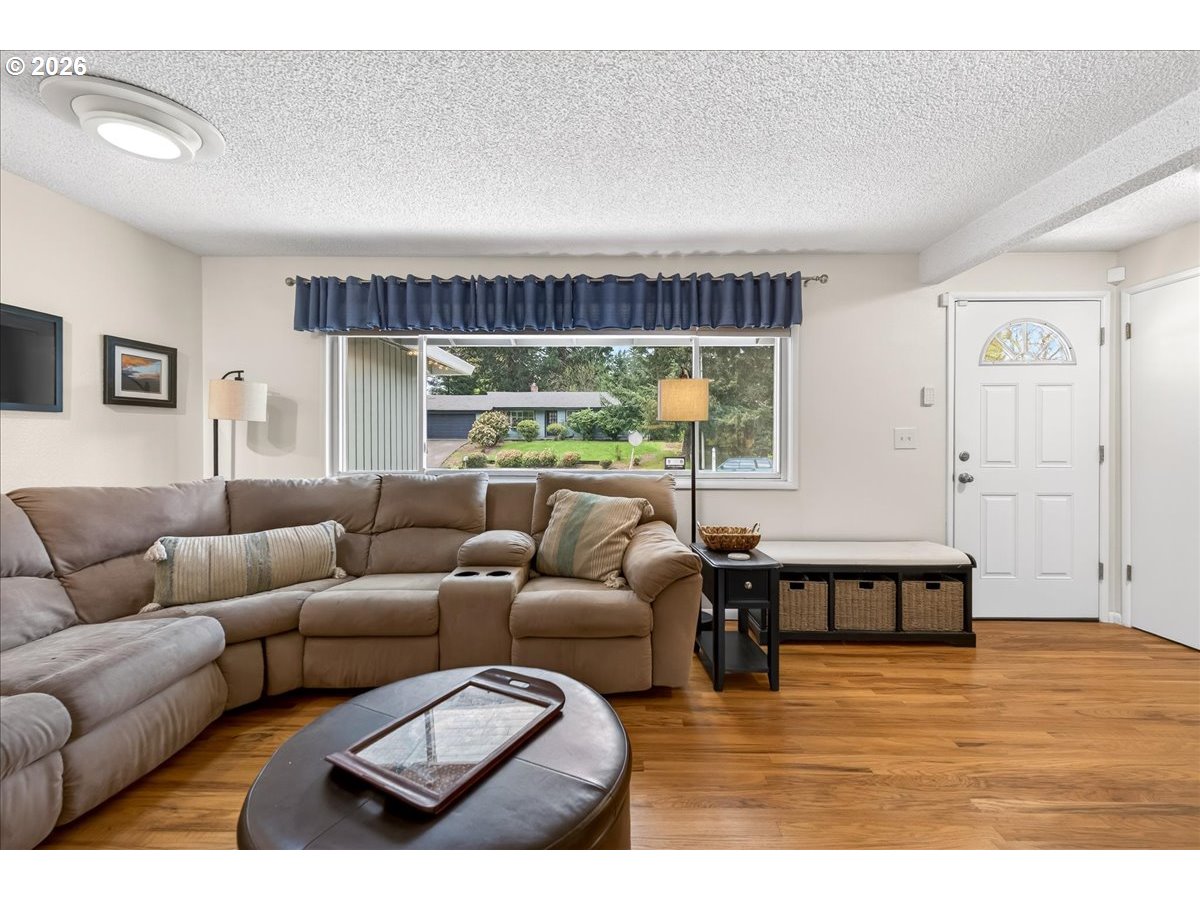 19650 Southwest Jaylee Street Beaverton, OR 97078 - Photo 16 of 46 a living room with furniture window and wooden floor