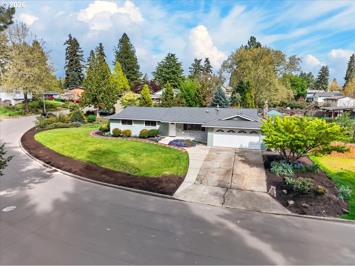 19650 Southwest Jaylee Street Beaverton, OR 97078 - Photo 2 of 46 a view of a house with a yard and potted plants