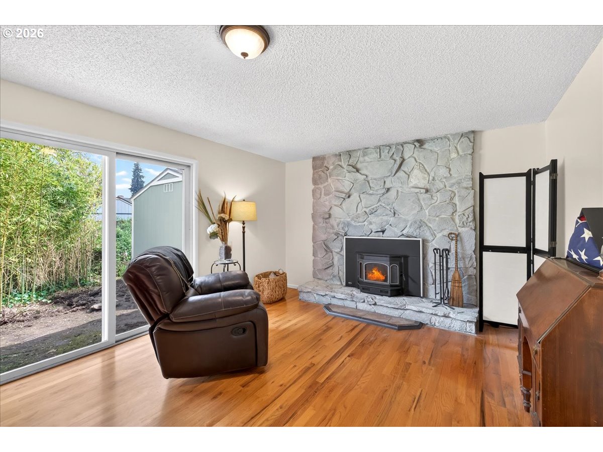 19650 Southwest Jaylee Street Beaverton, OR 97078 - Photo 26 of 46 a living room with furniture and a fireplace