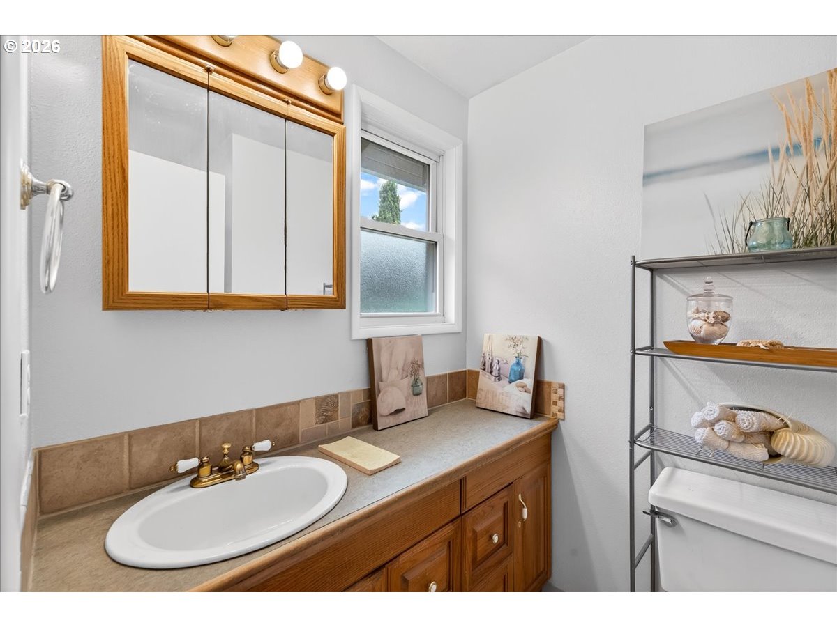 19650 Southwest Jaylee Street Beaverton, OR 97078 - Photo 30 of 46 a bathroom with a sink and a mirror