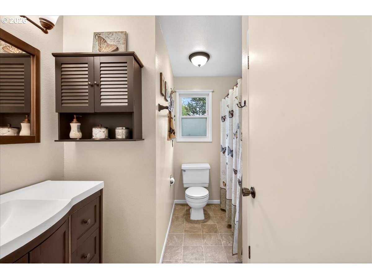 19650 Southwest Jaylee Street Beaverton, OR 97078 - Photo 34 of 46 a bathroom with a sink a toilet and shower