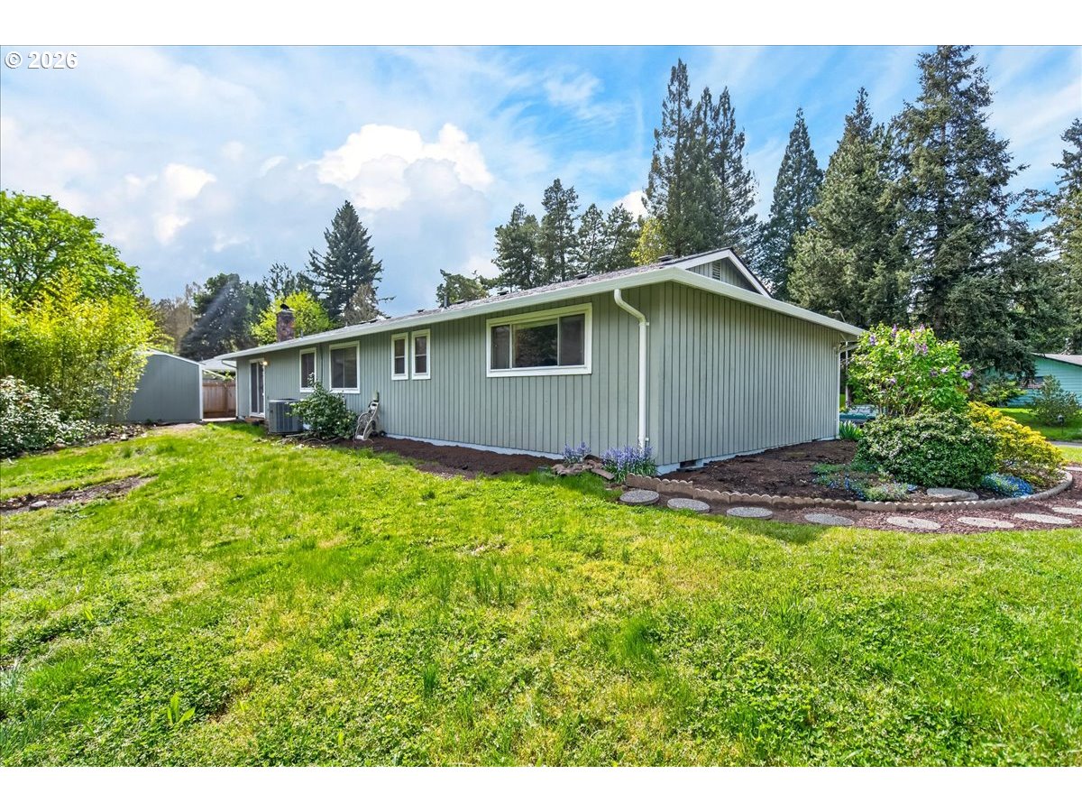 19650 Southwest Jaylee Street Beaverton, OR 97078 - Photo 38 of 46 a view of a house with a yard and sitting area