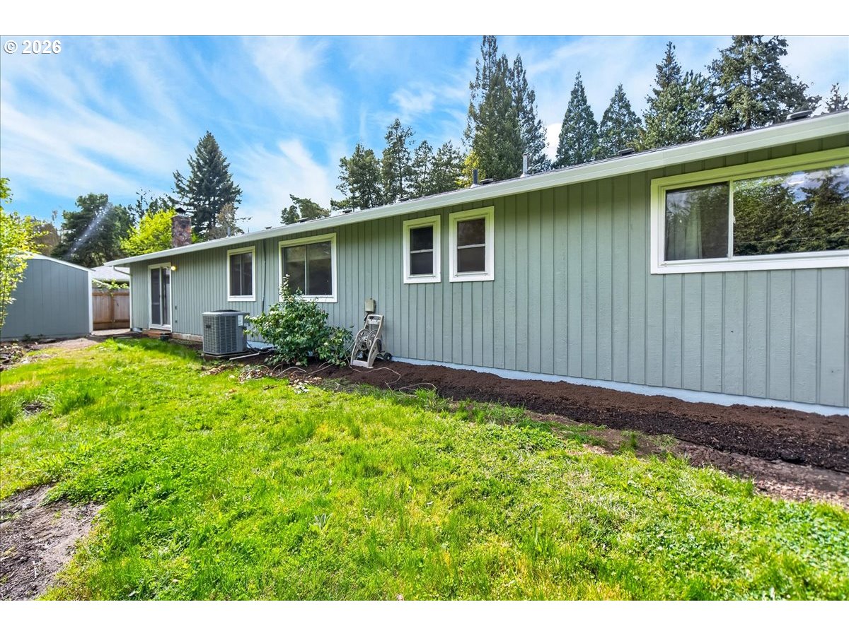 19650 Southwest Jaylee Street Beaverton, OR 97078 - Photo 39 of 46 a house with green field in front of it