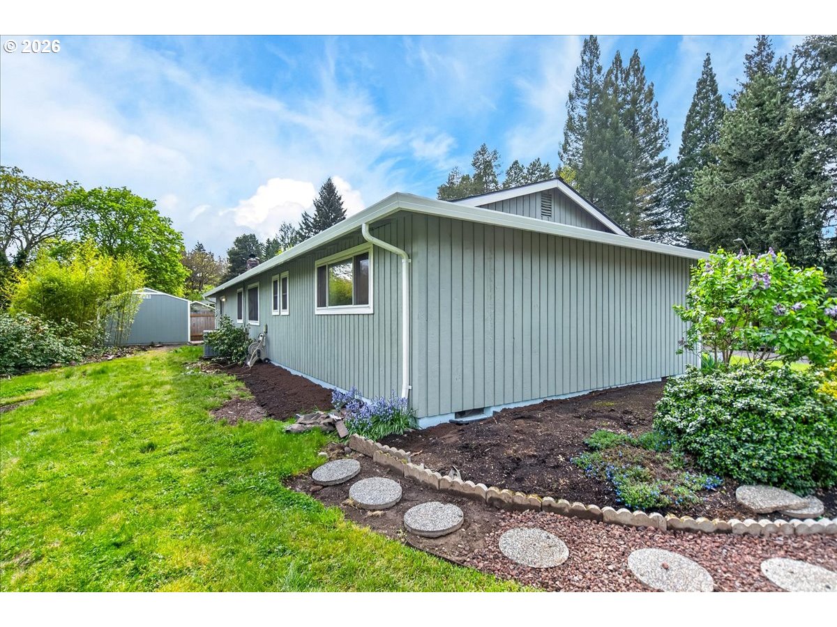 19650 Southwest Jaylee Street Beaverton, OR 97078 - Photo 40 of 46 a backyard of a house with lots of green space