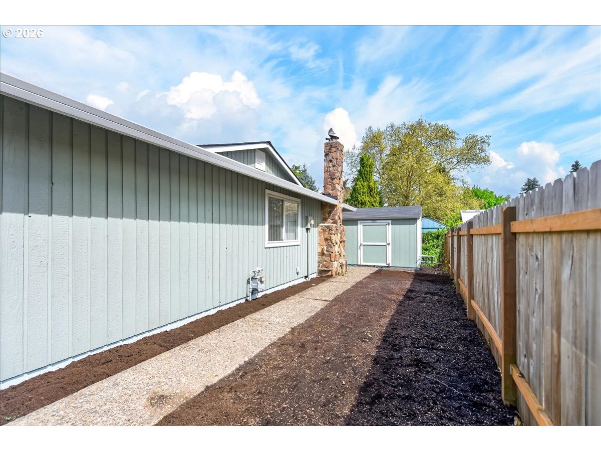 19650 Southwest Jaylee Street Beaverton, OR 97078 - Photo 42 of 46 a view of a backyard with wooden fence