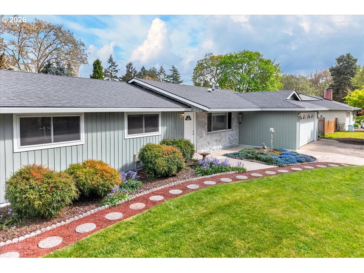 19650 Southwest Jaylee Street Beaverton, OR 97078 - Photo 8 of 46 a house view with a garden space