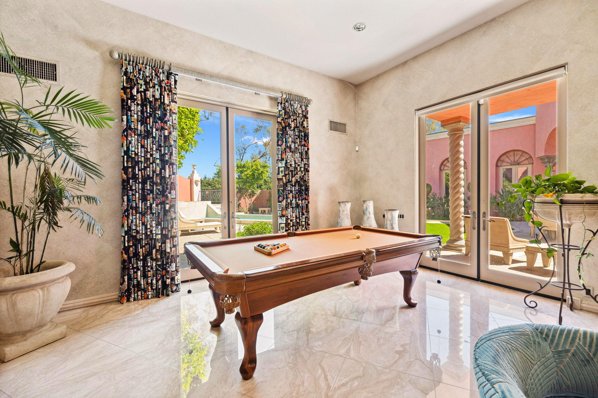 18 Vía Condotti Rancho Mirage, CA 92270 - Photo 12 of 69 a room with balcony and furniture