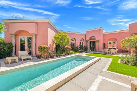 a view of living room with furniture and flowers