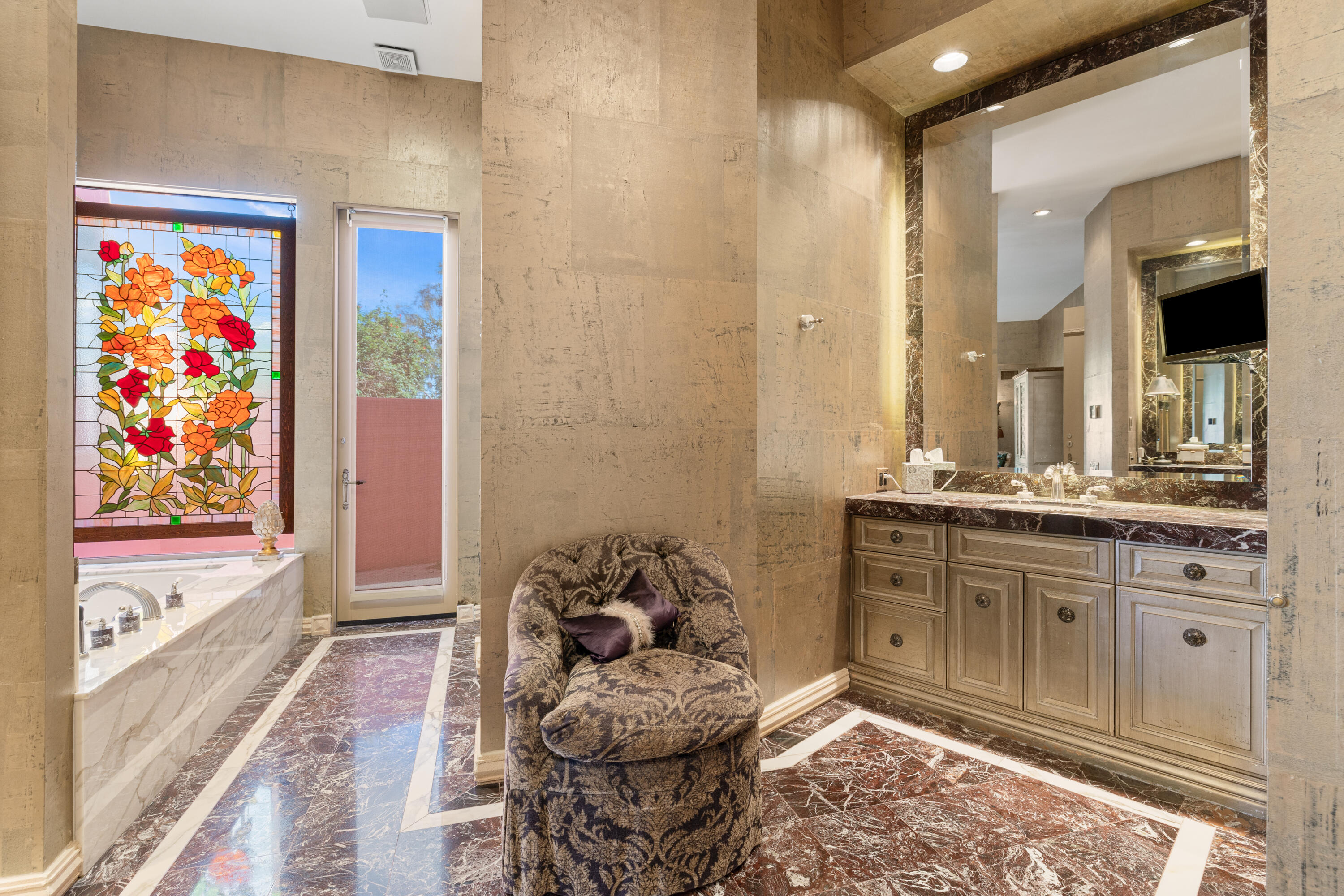 18 Vía Condotti Rancho Mirage, CA 92270 - Photo 15 of 79 a spacious bathroom with a granite countertop sink a mirror and a bathtub