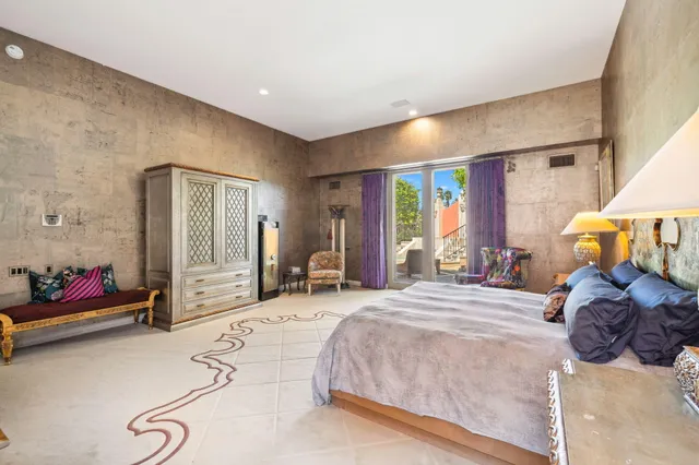 a bedroom with double bed and a window