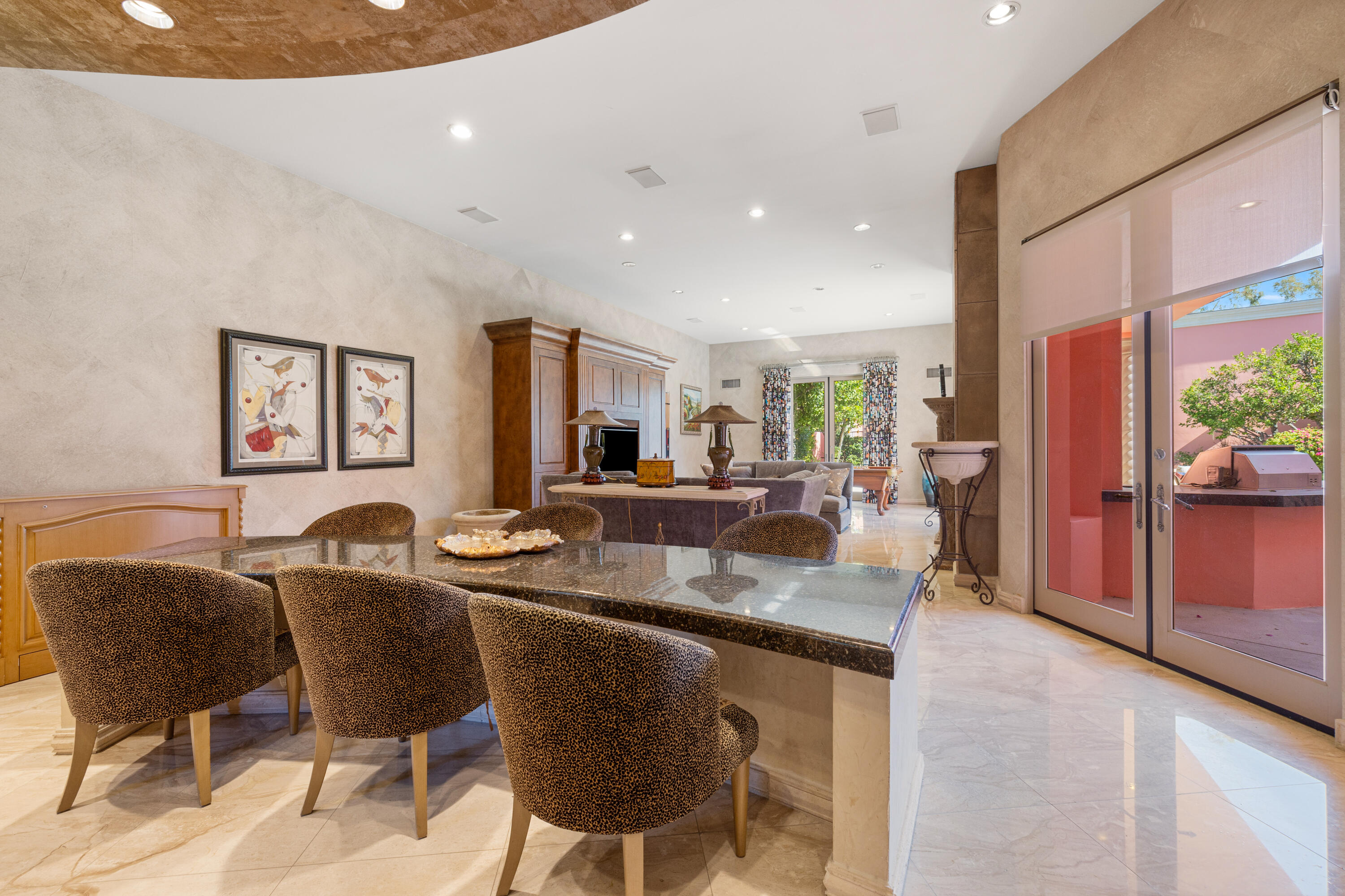 18 Vía Condotti Rancho Mirage, CA 92270 - Photo 28 of 79 a dining hall with stainless steel appliances granite countertop a table and chairs with wooden floor
