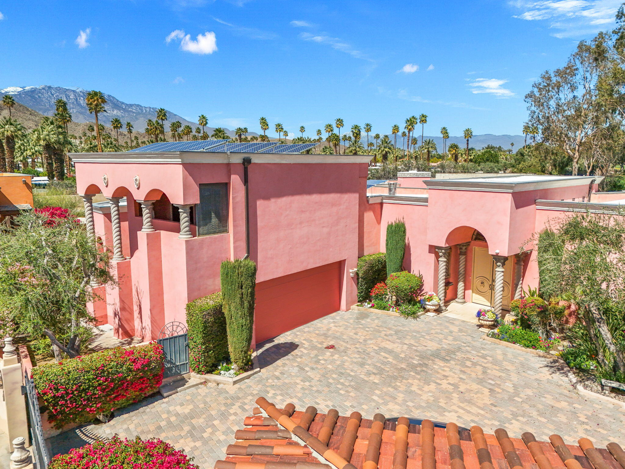 18 Vía Condotti Rancho Mirage, CA 92270 - Photo 29 of 69 a view of a house with a yard and potted plants