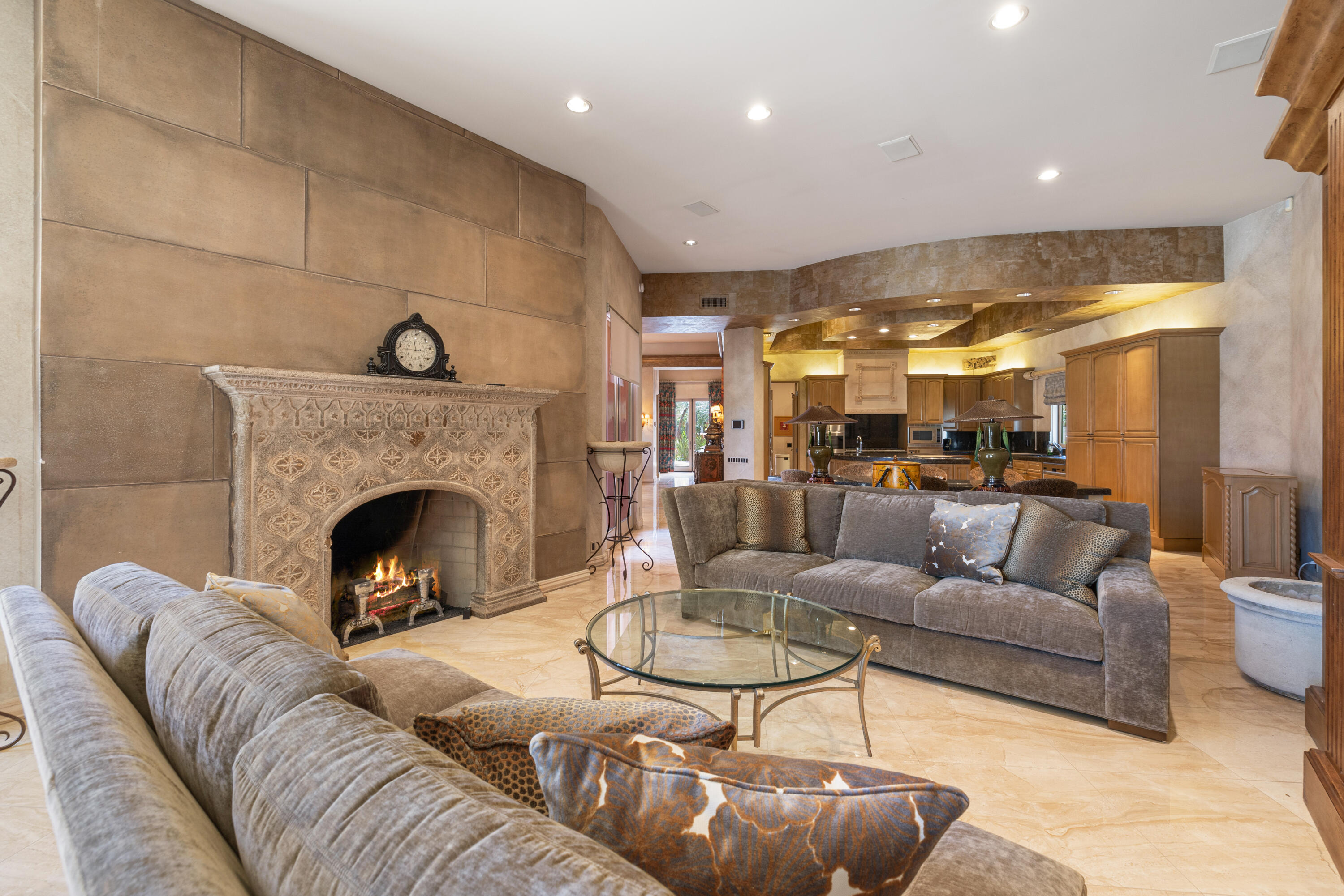 18 Vía Condotti Rancho Mirage, CA 92270 - Photo 30 of 79 a living room with furniture and a fireplace