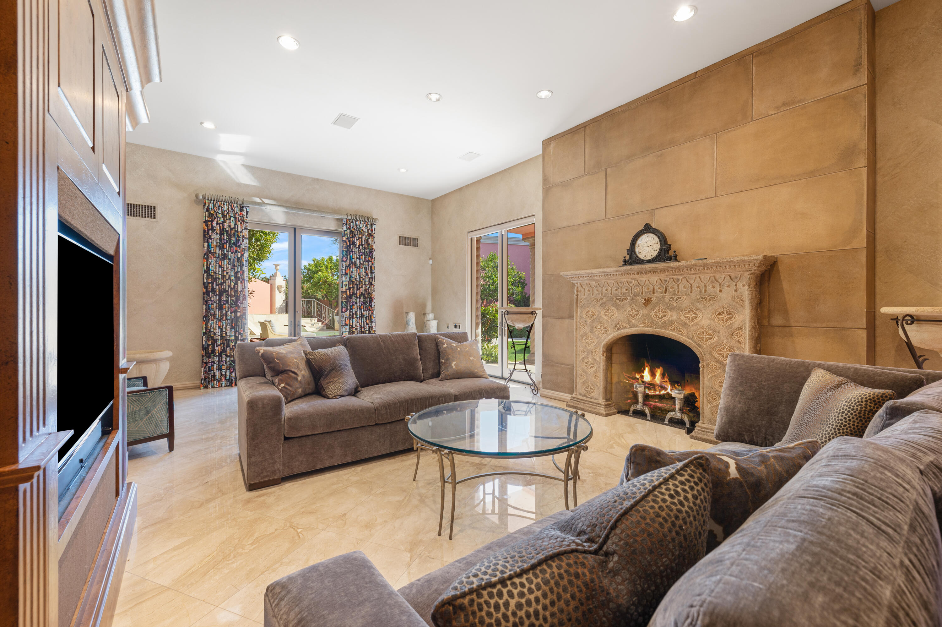 18 Vía Condotti Rancho Mirage, CA 92270 - Photo 31 of 79 a living room with furniture and a fireplace