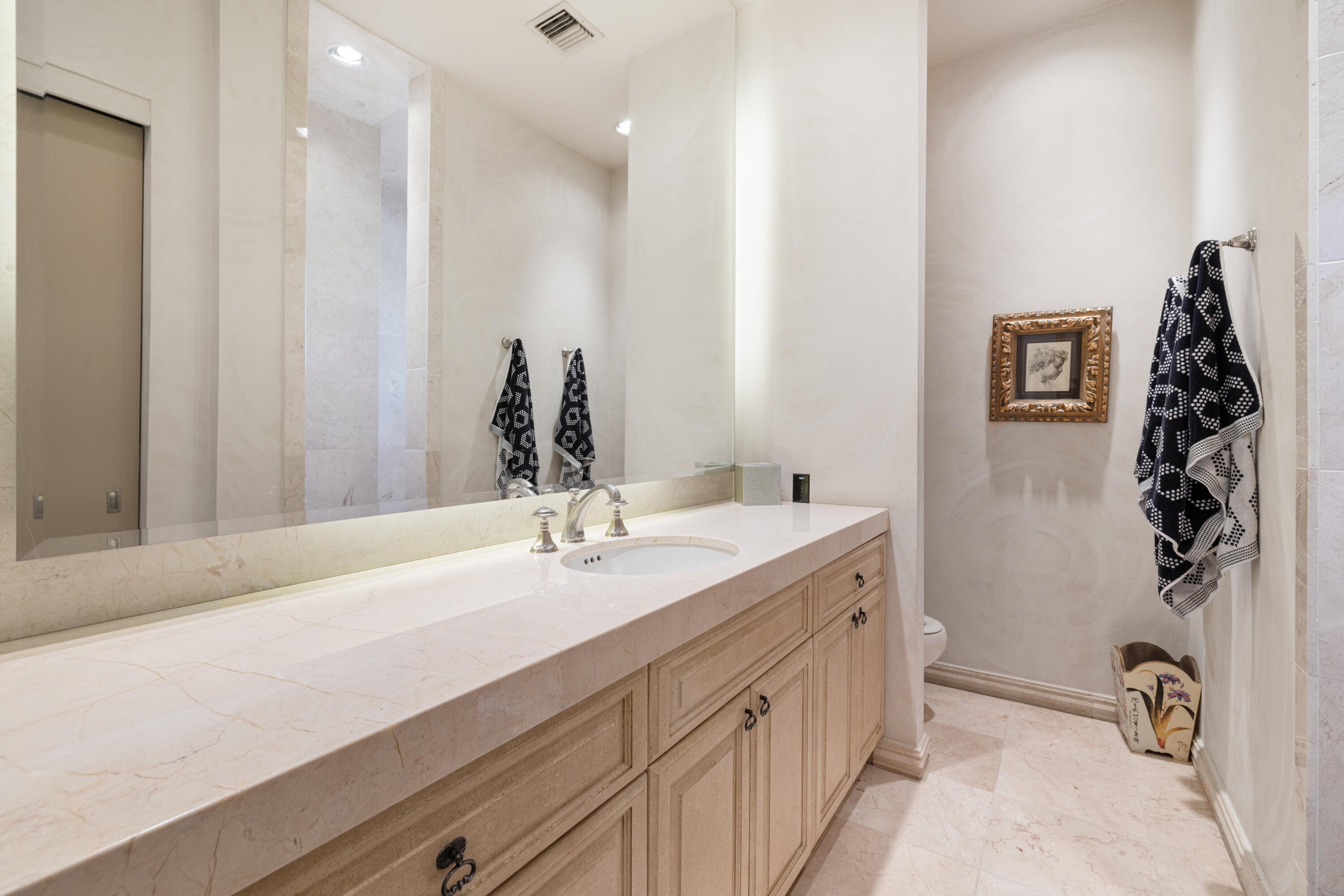 18 Vía Condotti Rancho Mirage, CA 92270 - Photo 36 of 79 a bathroom with a double vanity sink and a mirror