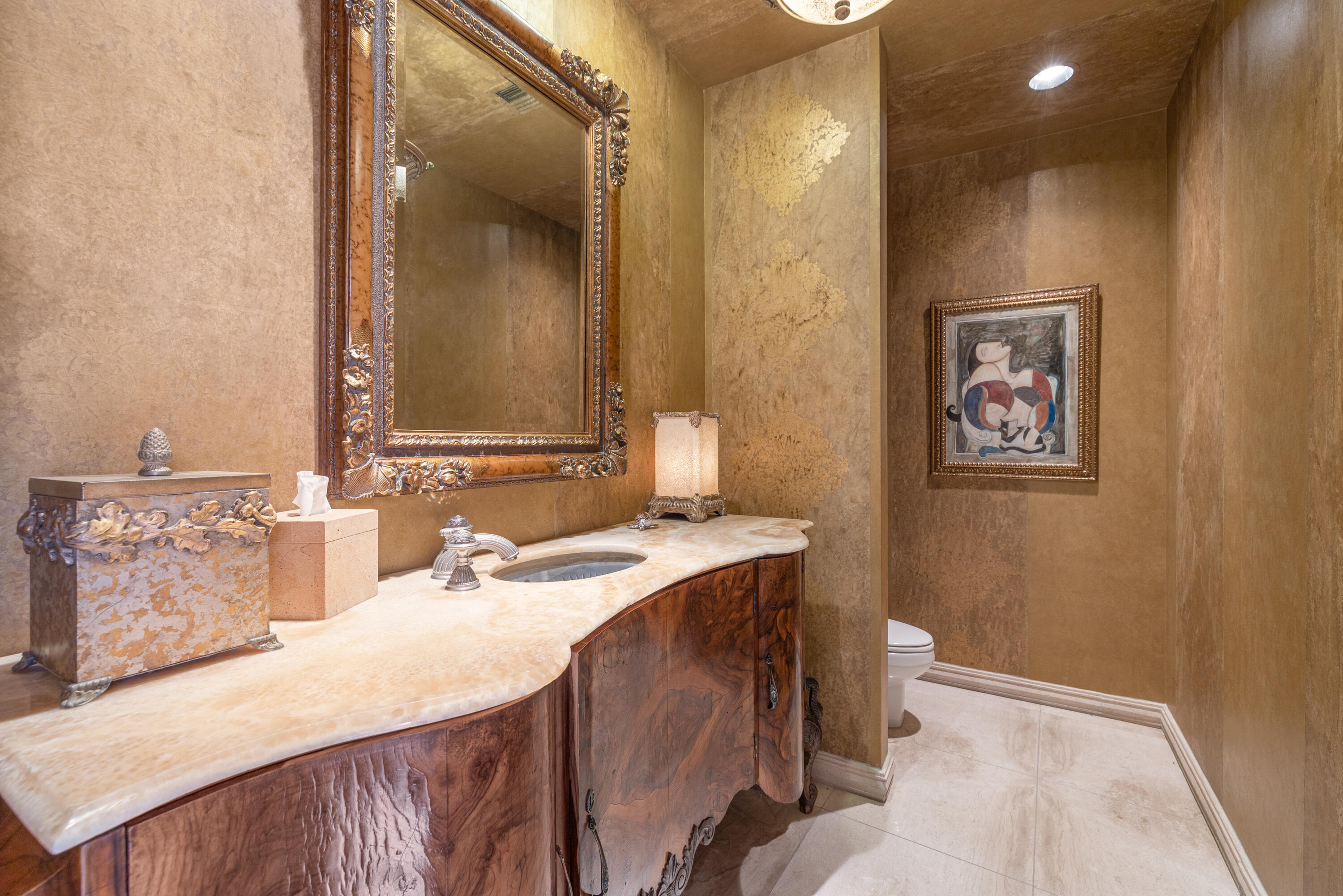 18 Vía Condotti Rancho Mirage, CA 92270 - Photo 37 of 79 a bathroom with a sink vanity and a mirror