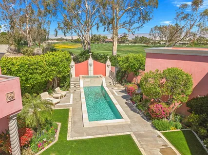 a view of a backyard with plants and patio