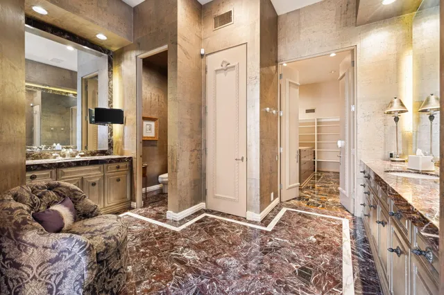 a bed room with a bed and a chair