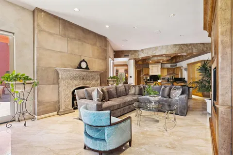 a view of a livingroom with furniture and a potted plant