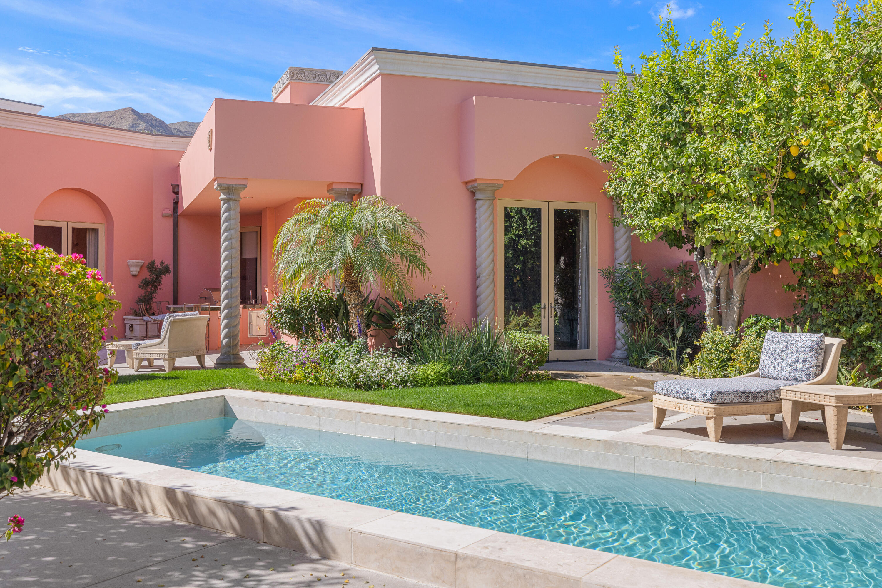 18 Vía Condotti Rancho Mirage, CA 92270 - Photo 47 of 79 a view of a house with a yard and sitting area