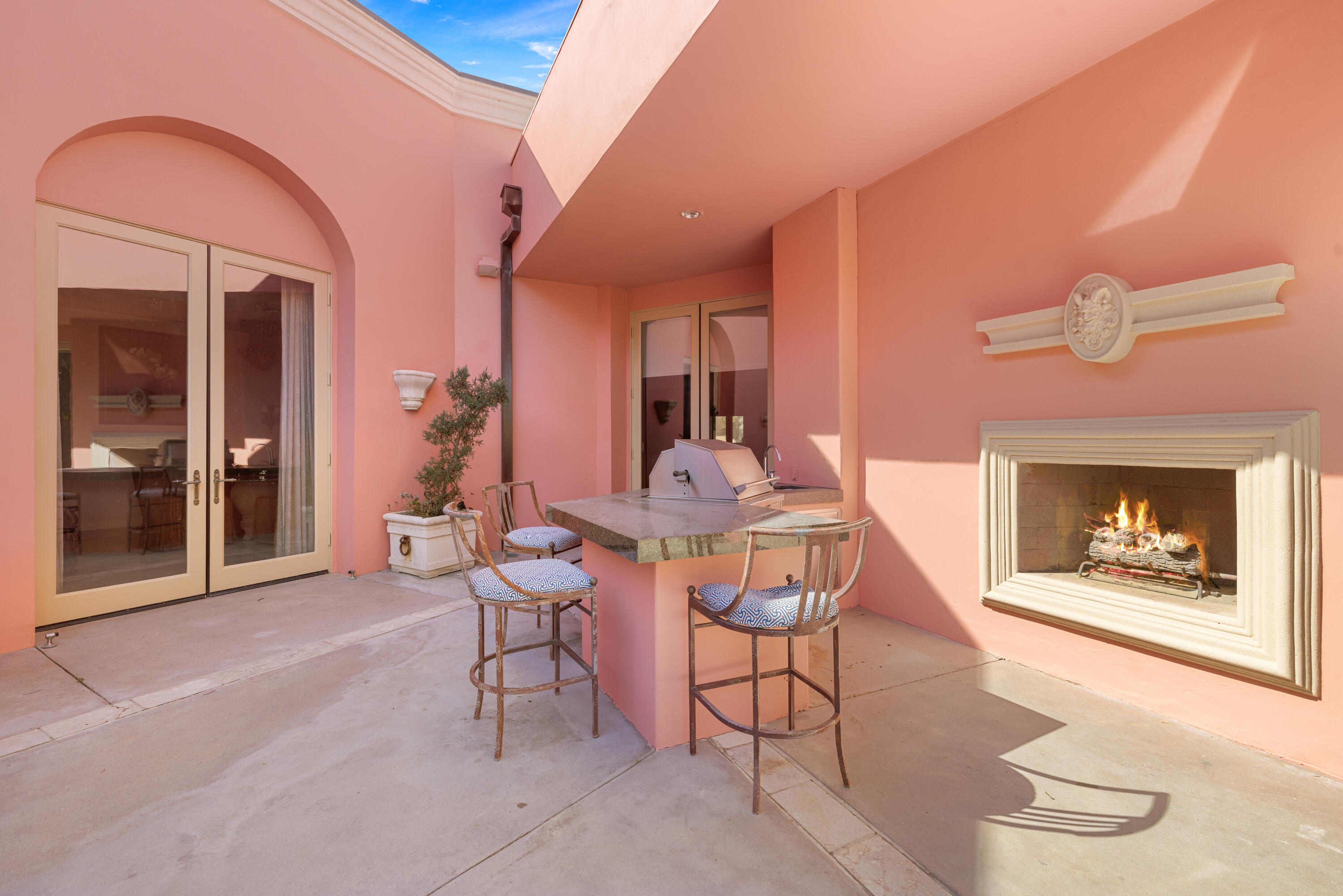 18 Vía Condotti Rancho Mirage, CA 92270 - Photo 55 of 79 a dining room with furniture and a fireplace